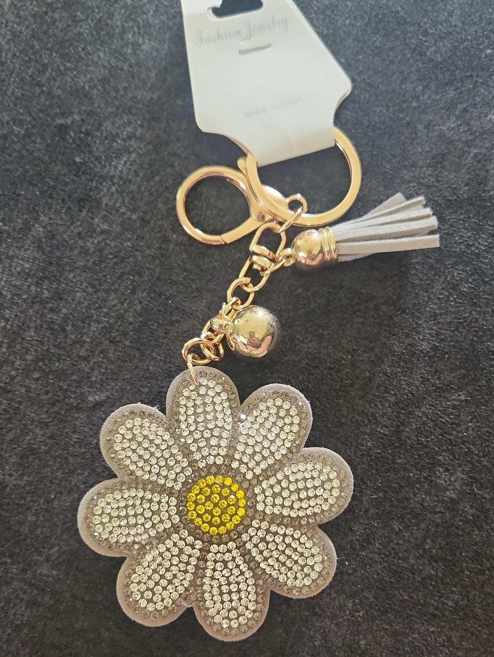 Gold & Crystal Daisy Keychain with Gray Tassel and Yellow Center